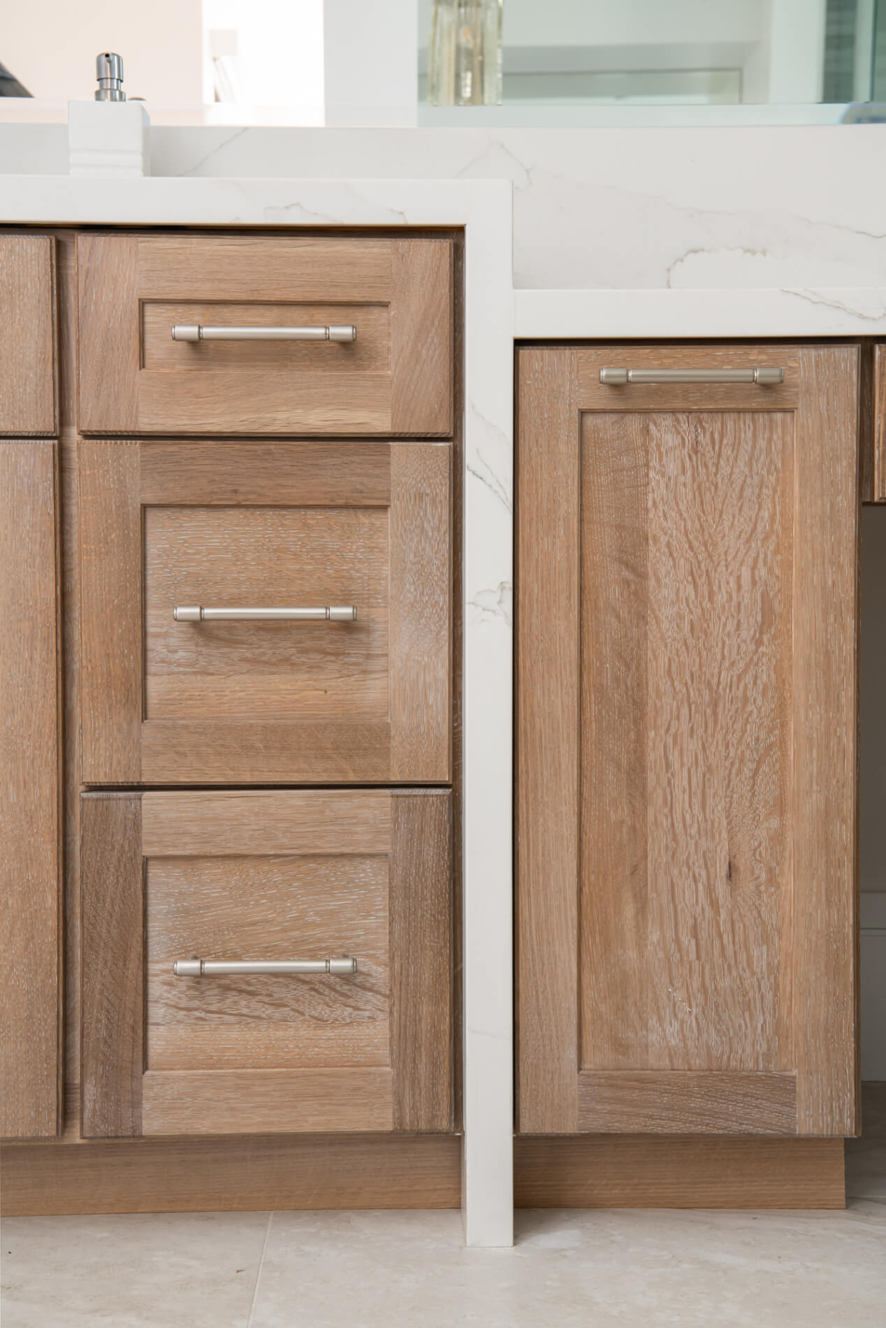 Cerused oak vanity cabinets in a Duluth bathroom remodel