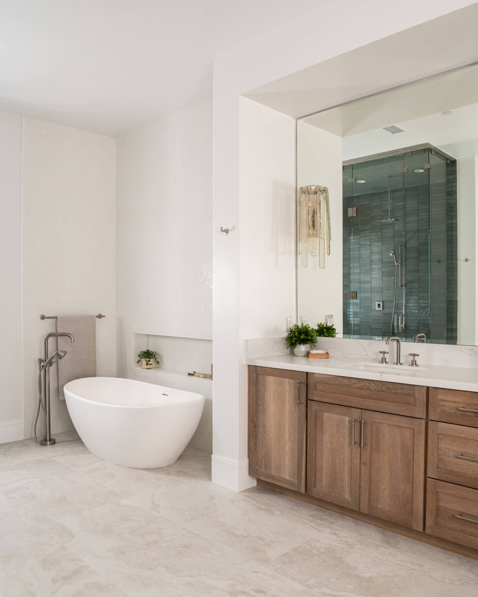 Bathroom remodel in Duluth with egg tub and oak vanity