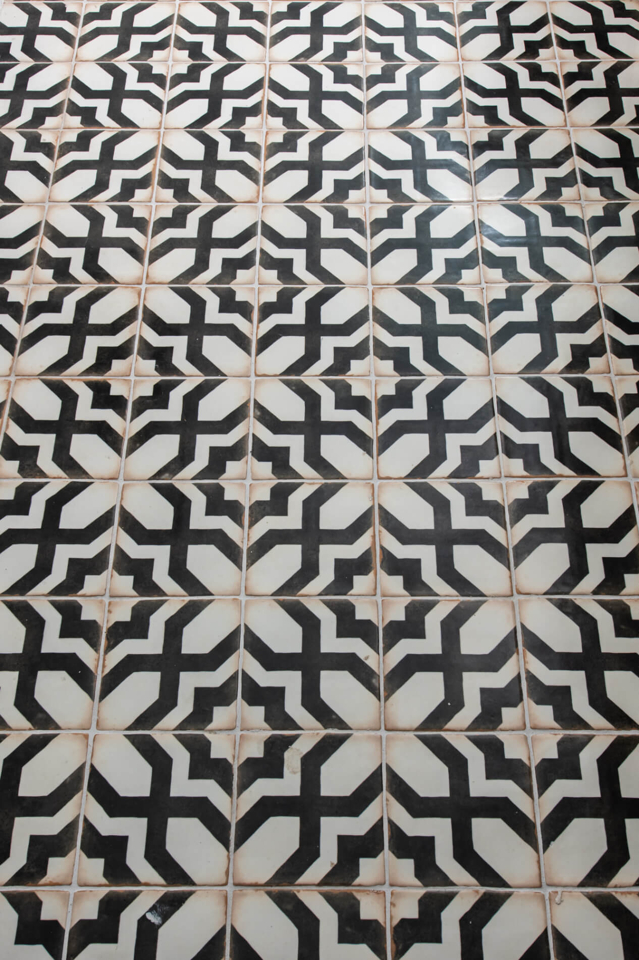 Black and cream patterned cement tile floor in Marietta bathroom
