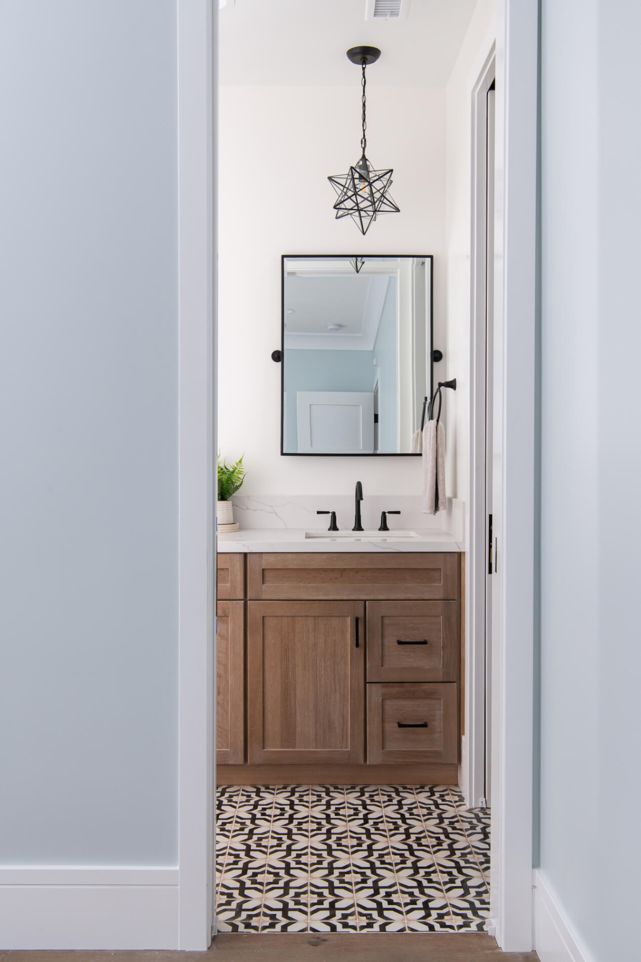 Depth shot from doorway with star pendant and patterned floor
