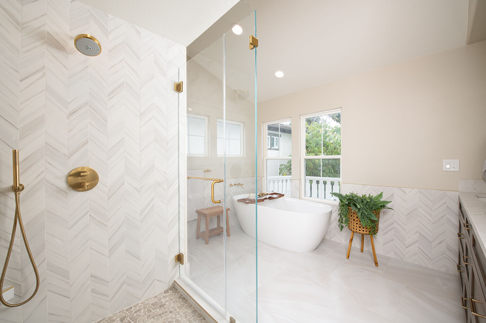 Master wide view with shower freestanding tub and walnut vanity