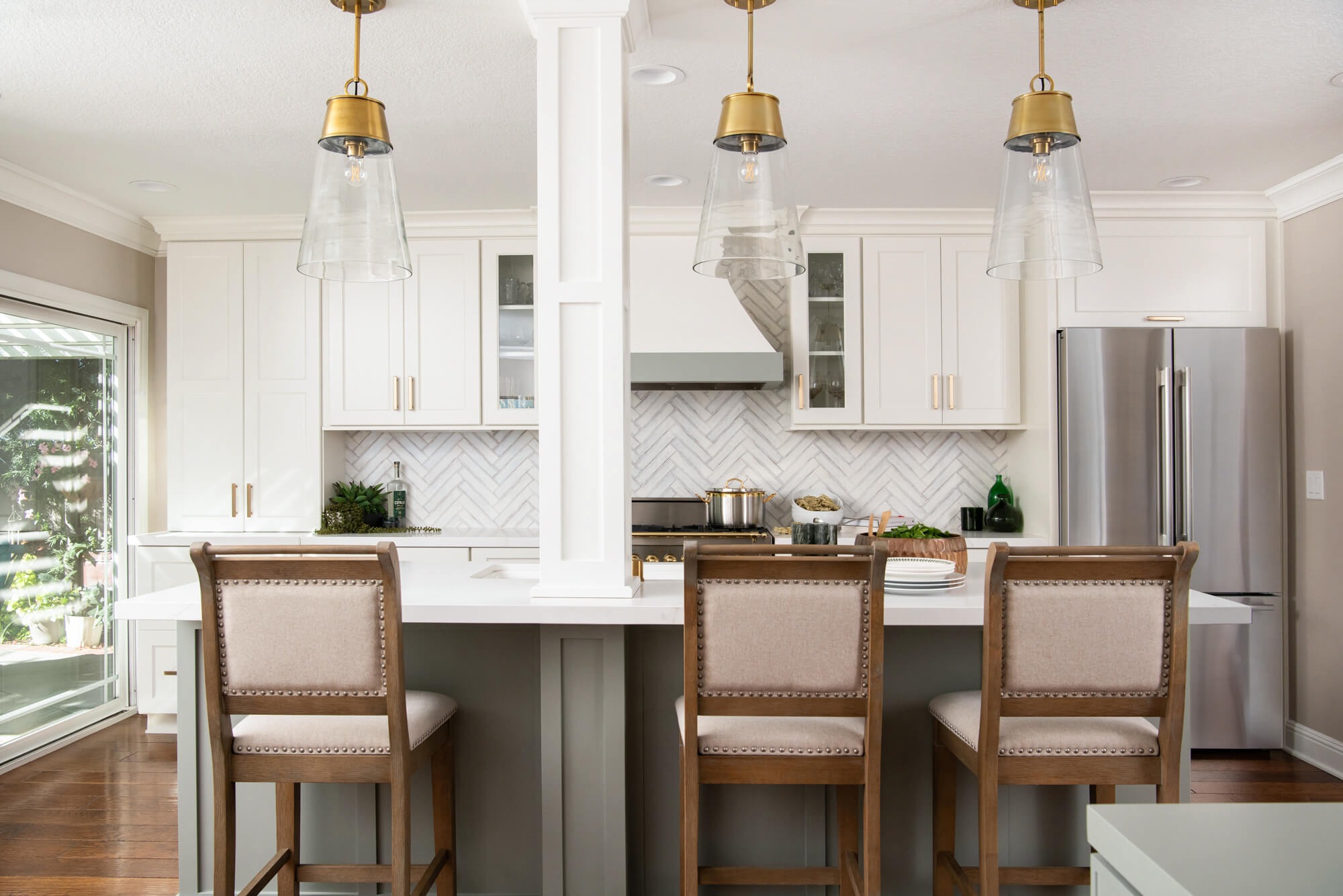 Sage painted island cabinets with white perimeter in Canton kitchen