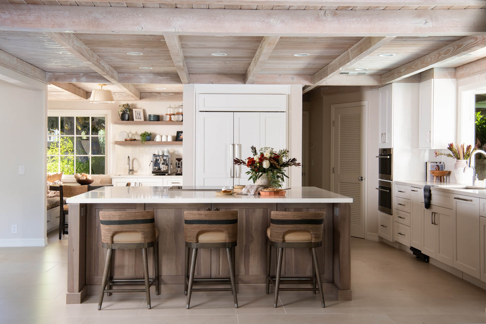 Coastal transitional kitchen remodel in Roswell with walnut island and wood beam ceiling