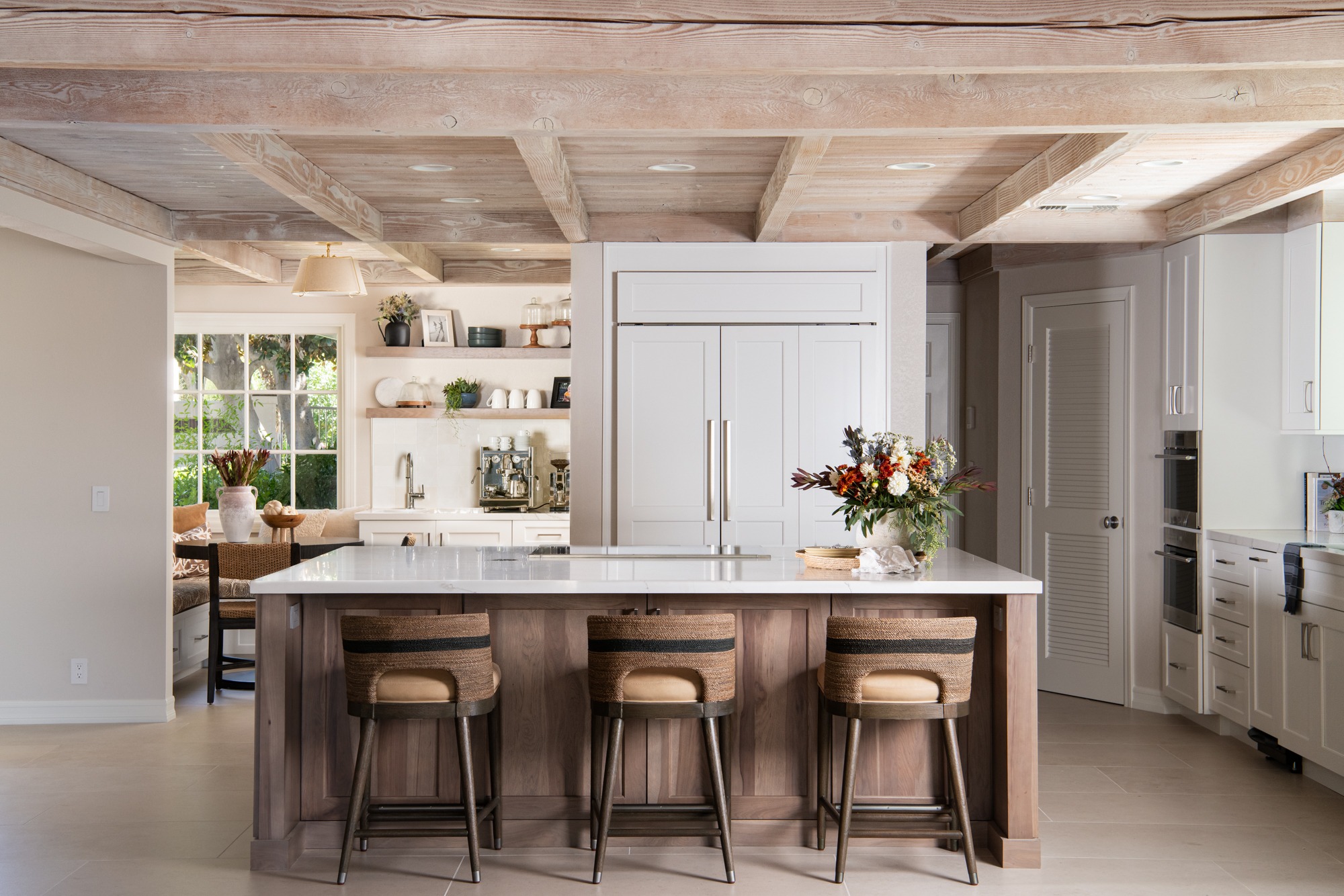 Wide alt view of coastal kitchen with breakfast nook