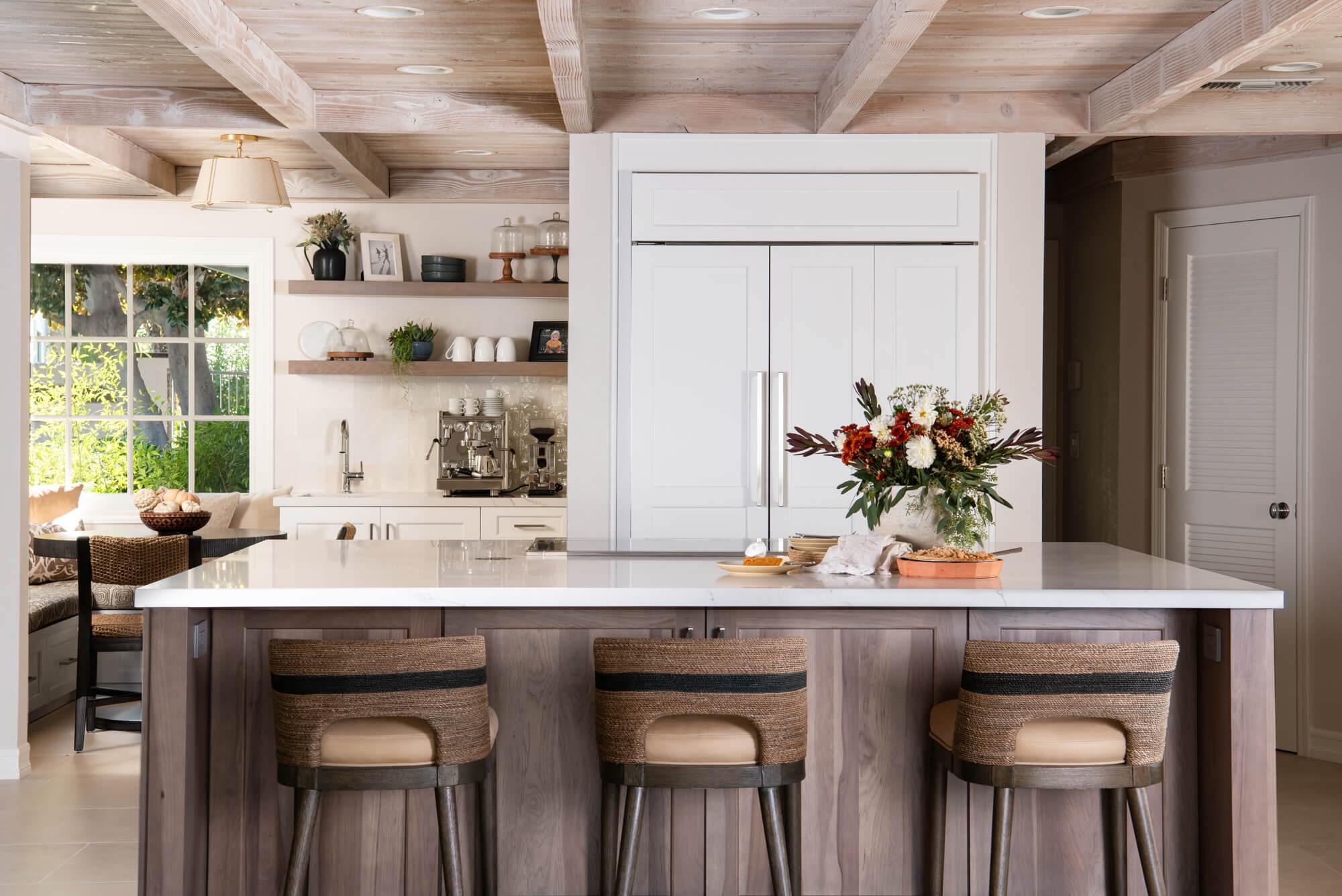 Coastal kitchen with open shelves and walnut island in Roswell