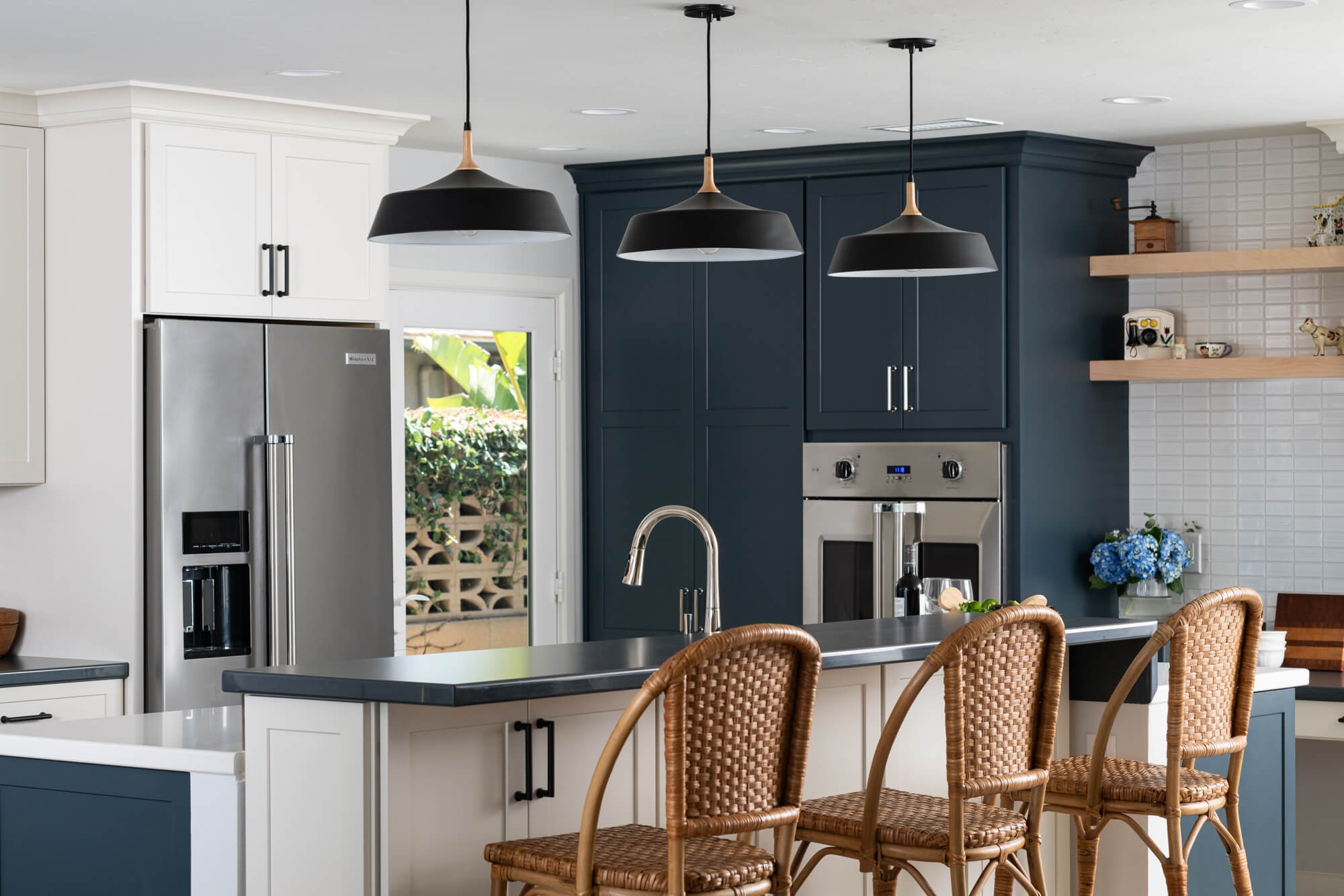 Open natural floating maple shelves with curated vintage pieces in Duluth kitchen