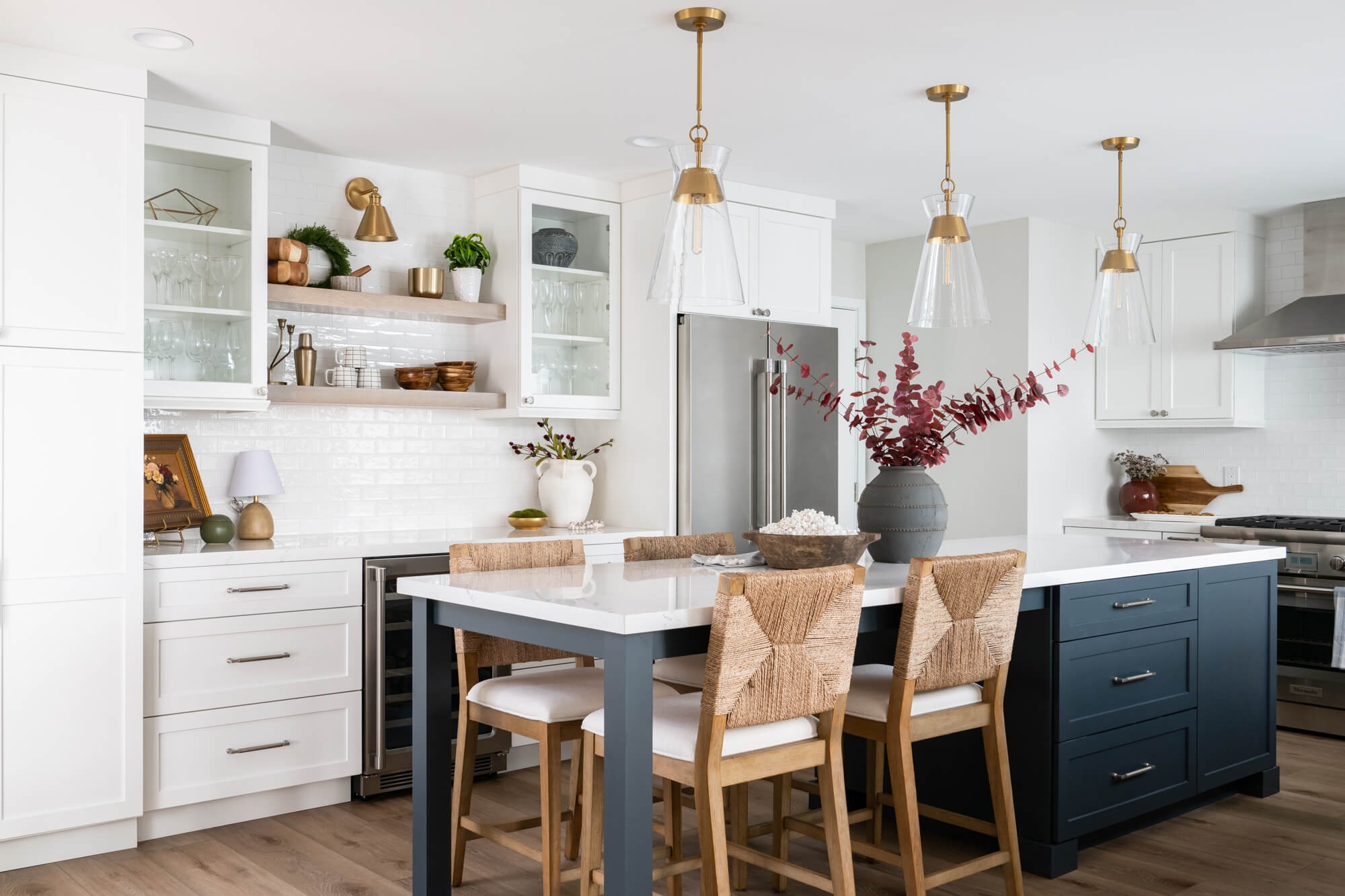 Custom kitchen island with navy base and seating in Sandy Springs