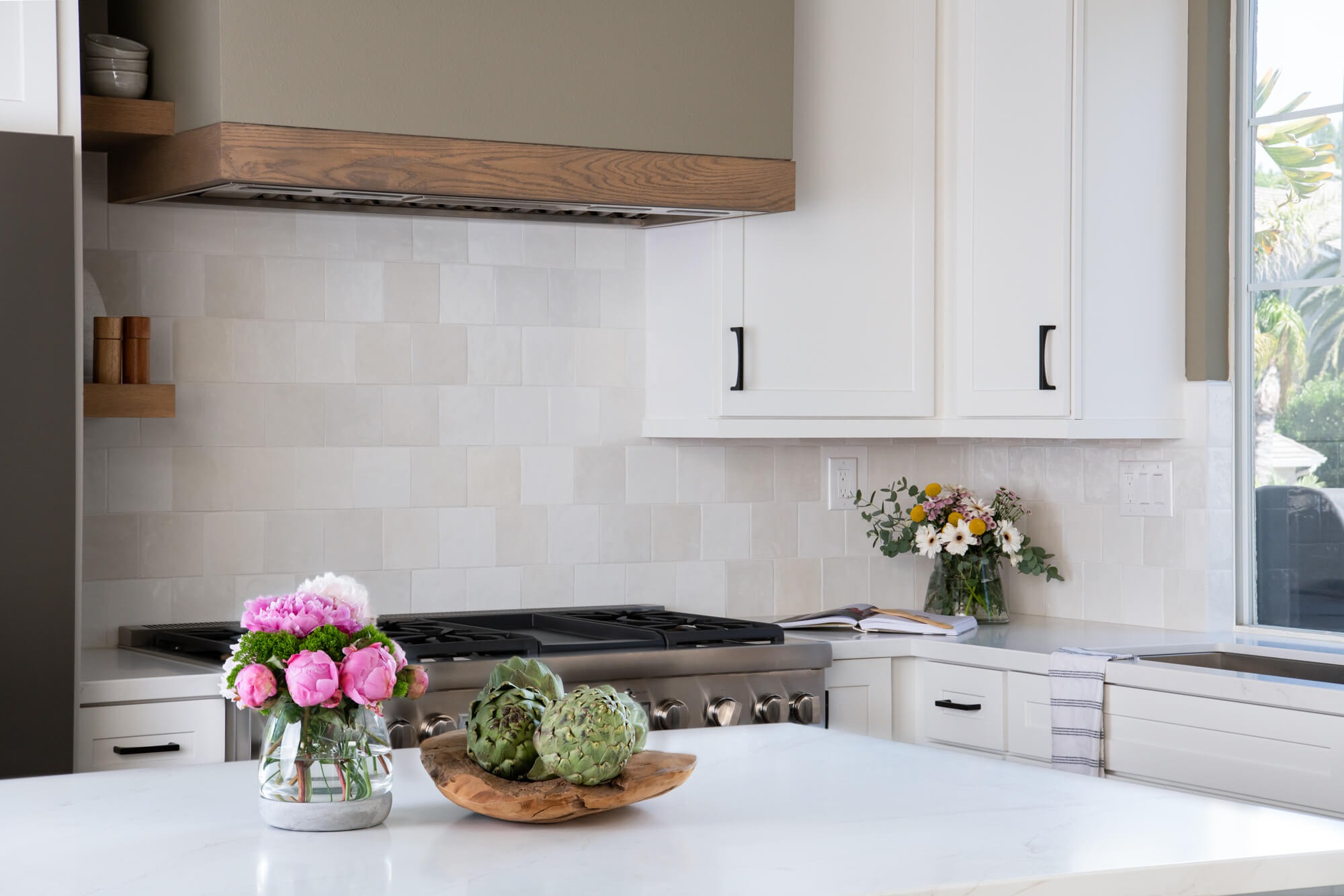 Modern farmhouse kitchen remodel in Cumming GA with wood-banded hood and zellige tile